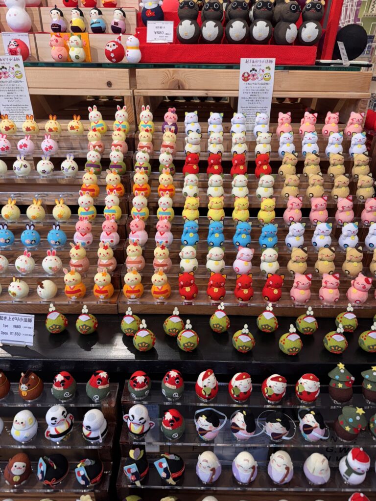 A display of Christmas-themed figurines, with a variety of small, colorful decorations